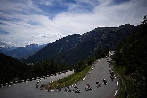 The pack rides during fourth stage of the cycling race